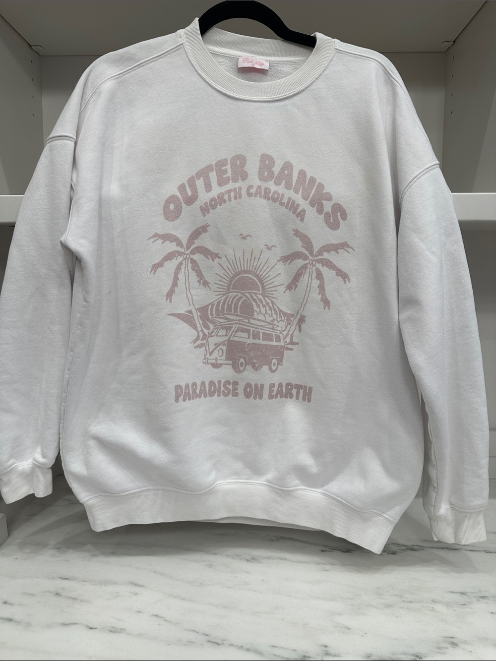Pink Lily small white with pale pink Outer Banks Graphic Crewneck Sweatshirt.